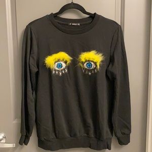 Cute black sweatshirt with sequin eye patches
